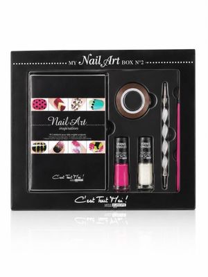 the nail art kit is in a black box with nail polish and nail brush