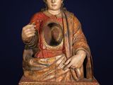 une image représentant une statue de Jésus tenant un miroir dans ses mains