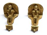 pair of antique brass figurines of a man and a woman