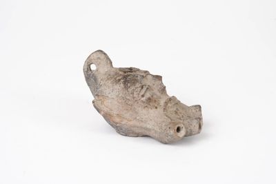 a small piece of pottery that is on a white surface