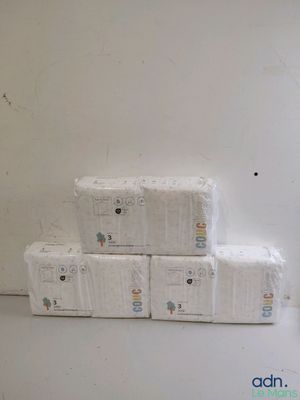 boxes of toilet paper stacked on top of each other in a room