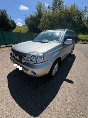 a picture of a silver suv parked in a parking lot