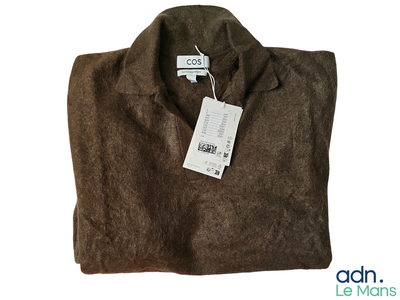 a brown shirt with a tag on it on a white background
