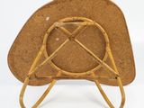 an image of a wooden chair with a brown seat and a brown cushion