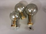 three light bulbs that are on a white surface