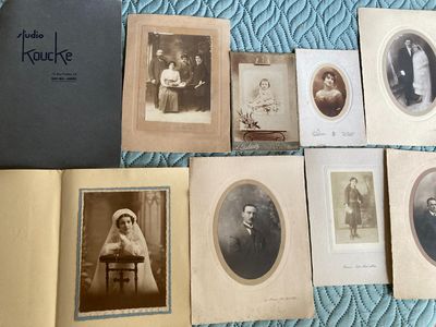 several old photos of people are sitting on a bed with a blue blanket