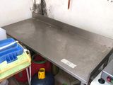 an image of a kitchen area with a stove and a table