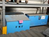two blue boxes that are on a shelf in a warehouse