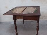 a small table with a book on top of it