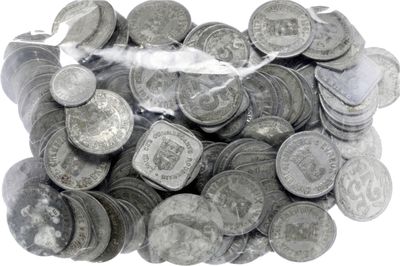 a bag full of silver coins on a white surface
