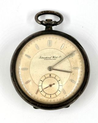 an old pocket watch with roman numerals on the face