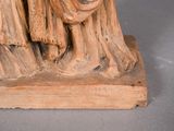 a statue of a man and a woman sitting on a bench