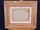 an old picture frame with a piece of fabric hanging from it
