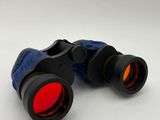 a close up of a pair of binoculars on a white surface