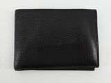 un portefeuille en cuir noir posé sur une table blanche