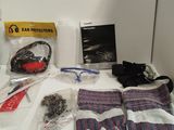 the contents of a motorcycle helmet, gloves, gloves, and other items laid out on a counter