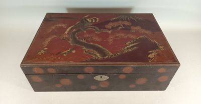 an old wooden box with a dragon design on it