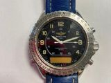a watch that is sitting on a blue strap