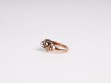 an image of a gold ring with a diamond