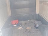 an image of a truck with the back of it ' s bed open
