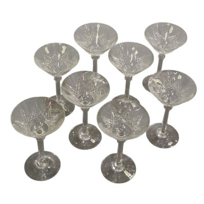 six clear glass wine glasses sitting on top of each other
