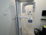 an image of a medical room with a large monitor on the wall