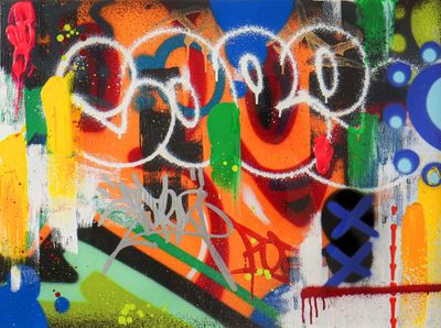 graffiti on the wall of a building with a lot of graffiti on it