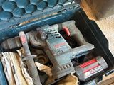 a tool box full of tools sitting on the floor