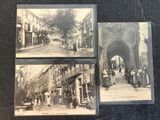 three old black and white photos of people walking down a street