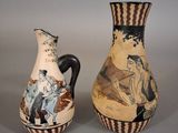 two vases sitting side by side on a table