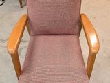 a chair that is sitting in the middle of a room
