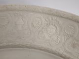 a white plate that has a design on it