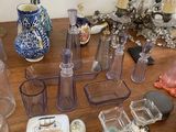 a table with a lot of glass items on it