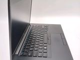 a laptop that is sitting on a white surface