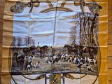 a picture of a table cloth with a picture of a hunting scene on it