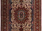 a red and blue rug with a medallion design on it
