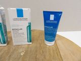 a tube of toothpaste and a tube of toothpaste on a table