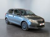 the silver car is parked in a white room with a black floor