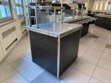 stainless steel counter top in a commercial kitchen with a large window