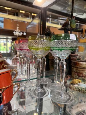 many glasses on a glass table in a store