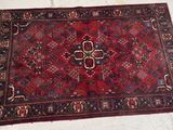 a rug on the floor with a cross on it