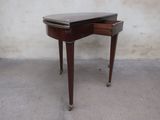 a small table with a drawer on top of it