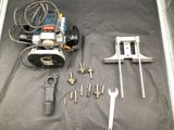 tools laid out on a table with a black background