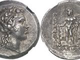 a close up of a silver coin with an image of a woman on it