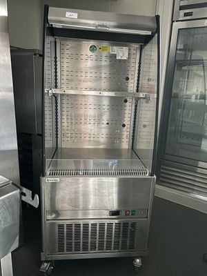 a stainless steel refrigerator and freezer in a kitchen