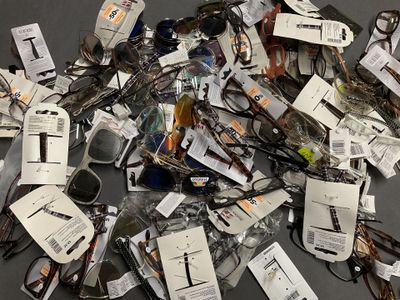 a pile of assorted electronic devices on a table