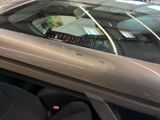 a close up of a car ' s dashboard with the sunroof