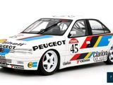 the car is white and blue with red, yellow, and blue stripes on it