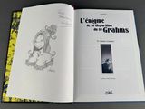 an open book with a drawing of a woman on it