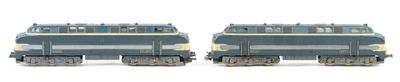two blue trains on a white background one is blue and the other is yellow